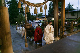 Head priest leads participants into the shrine.