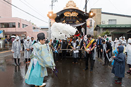 Floats receive a blessing from the shrine priest.